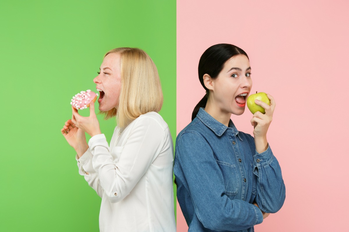 dieting-concept-healthy-useful-food-beautiful-young-women-choosing-fruits-unhealthy-cake-studio.jpg